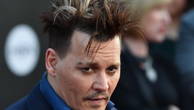 Actor Johnny Depp attends the premiere of Disney's "Alice Through The Looking Glass," May 23, 2106 at the El Capitan Theatre in Hollywood, California. / AFP PHOTO / Robyn BECK